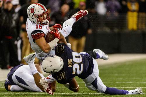 Trent Nelson  |  The Salt Lake Tribune
Utah Utes wide receiver Britain Covey (18) is tackled by Washington Huskies defensive back Kevin King (20) as the University of Utah faces the University of Washington, NCAA football at Husky Stadium in Seattle, Saturday November 7, 2015.