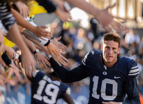 Trent Nelson  |  The Salt Lake Tribune
Brigham Young Cougars wide receiver Mitch Mathews (10) high-fives fans after the 70-6 win as BYU hosts Wagner, NCAA football at LaVell Edwards Stadium in Provo, Saturday October 24, 2015.