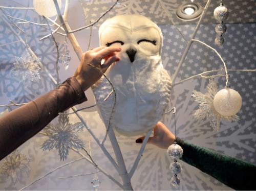 Al Hartmann  |  The Salt Lake Tribune
Artists put finishing touches on "I'm Dreaming of a White Christmas" at the Grand America's holiday window display, ìSounds of the Season."  Each window represents a favorite Christmas carol.