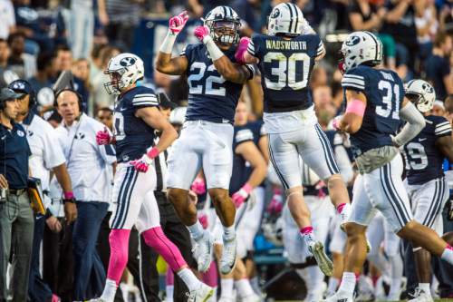 Chris Detrick  |  The Salt Lake Tribune
Brigham Young Cougars linebacker Manoa Pikula (22) and Brigham Young Cougars defensive back Michael Wadsworth (30) celebrate after recovering a blocked field goal attempt during the game at LaVell Edwards Stadium Friday October 16, 2015.