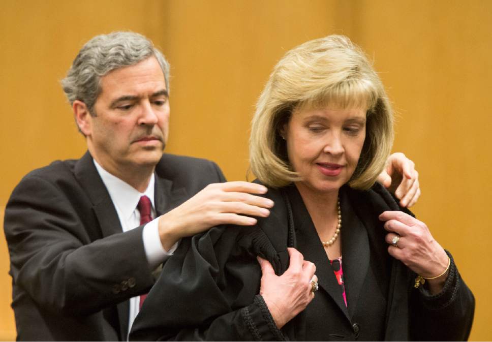 Rick Egan  |  The Salt Lake Tribune

Blake Parrish performs the Presentation of the Robe to his wife, Jill N. Parrish, during her investiture as a new federal judge, at the Federal Court Room, Monday, November 23, 2015.