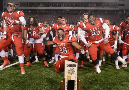 Scott Sommerdorf   |  The Salt Lake Tribune
East players do the Haka with the 4A trophy after East beat Timpview 49-14 for the Utah 4A championship, Friday, November 20, 2015.