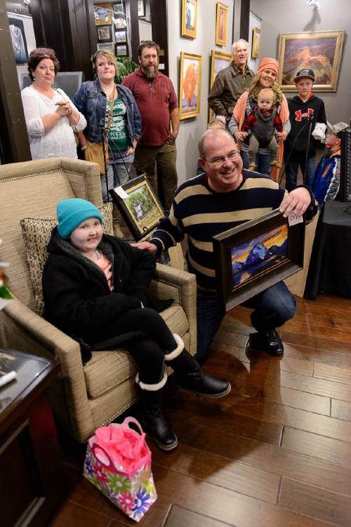 Trent Nelson  |  The Salt Lake Tribune
Jeff Beard, right, poses for a photo with BayLee Parks, a young girl and artist who has been battling cancer for 7 years, at the Illume Gallery in Salt Lake City, Thursday November 12, 2015. Dozens of people attended the show of Parks' paintings, including many artists, who brought paint brushes as gifts to Parks. Beard purchased Parks' painting "Sunset Over The Mountains." All of her paintings sold.