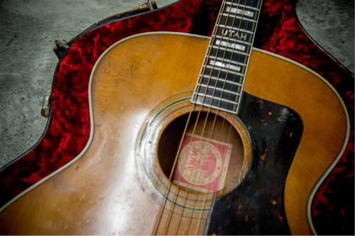 Jeremy Harmon  |  The Salt Lake Tribune
This guitar belonged to folk singer and IWW member Utah Phillips. In 1988 some of Joe Hill's ashes were returned to the IWW after they were discovered in the National Archives. Some of the ashes were placed inside this guitar.