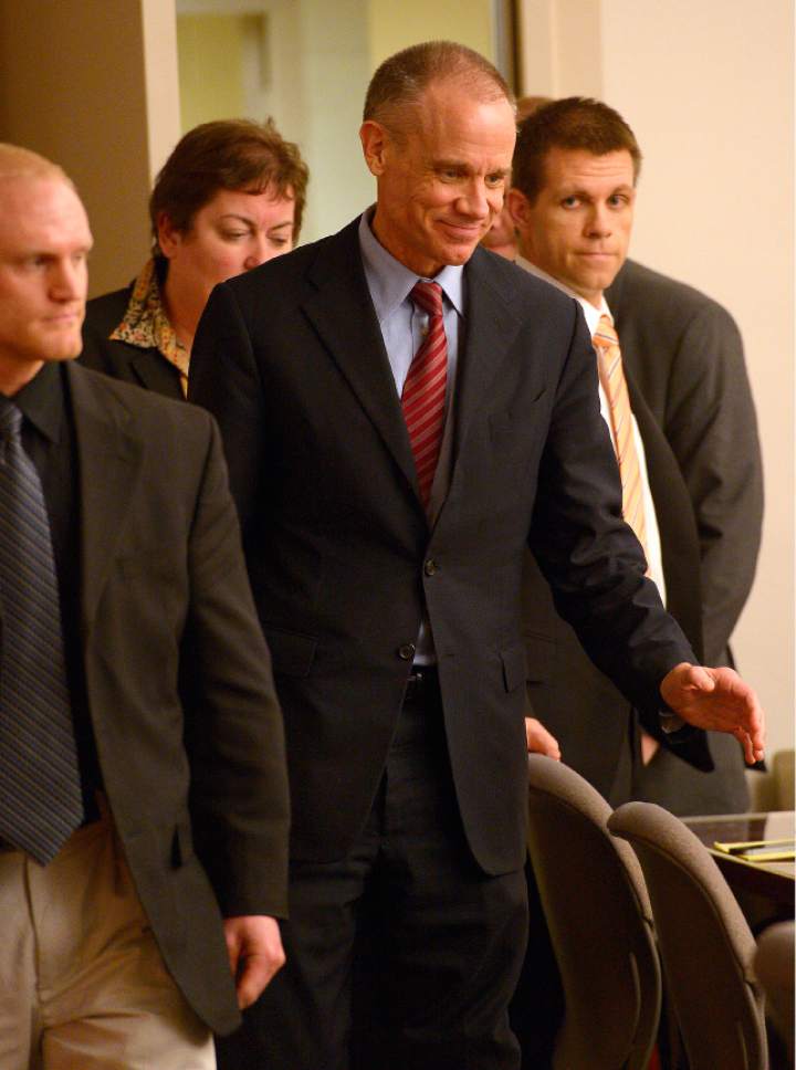 Leah Hogsten  |  The Salt Lake Tribune
Marc Sessions Jenson smiles as he enters the courtroom to hear the verdict. Jenson was found not guilty Friday, January 30, 2015 of fraud and money laundering in connection with the failed Mount Holly golf and ski resort near Beaver -- a case with ties to the bribery and corruption investigation of former Utah attorneys general Mark Shurtleff and John Swallow.
Following a three-week trial, a jury of five men and three women deliberated 14 hours over two days before acquitting Jenson of four counts each of second-degree felony communications fraud and money laundering.