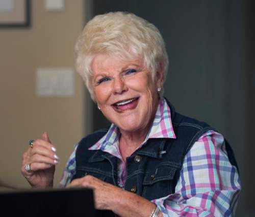 Rick Egan  |  The Salt Lake Tribune

Edna Anderson-Taylor, smiles as she sings and plays  the piano in her Salt Lake City home. Taylor, known by many as "Miss Julie" from her 17 years as host of the "Romper Room" children's television show, Tuesday, November 3, 2015.