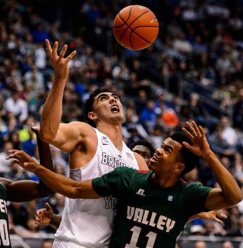 Trent Nelson  |  The Salt Lake Tribune
Brigham Young Cougars center Corbin Kaufusi (44) and Mississippi Valley State Delta Devils guard Kylan Phillips (11) look to the loose ball as BYU hosts Mississippi Valley State, NCAA basketball at the Marriott Center in Provo, Wednesday November 25, 2015.