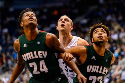 Trent Nelson  |  The Salt Lake Tribune
Mississippi Valley State Delta Devils guard Isaac Williams (24), Brigham Young Cougars forward Nate Austin (33) and Mississippi Valley State Delta Devils center Latrell Love (23) look for the rebound as BYU hosts Mississippi Valley State, NCAA basketball at the Marriott Center in Provo, Wednesday November 25, 2015.