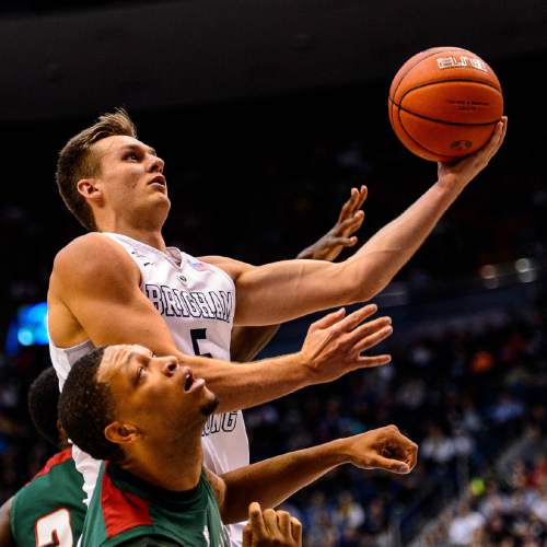 Trent Nelson  |  The Salt Lake Tribune
Brigham Young Cougars guard Kyle Collinsworth (5) puts up a shot, with Mississippi Valley State Delta Devils forward Michael Matlock (22) defending, as BYU hosts Mississippi Valley State, NCAA basketball at the Marriott Center in Provo, Wednesday November 25, 2015.