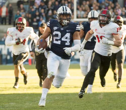 Rick Egan  |  The Salt Lake Tribune

Brigham Young running back Algernon Brown (24) beats his defenders to the end zone, as he runs for a long touchdown for the Cougars, as BYU defeated the Fresno Bulldogs 52 -10, at Lavell Edwards stadium, Tuesday, November 21, 2015.