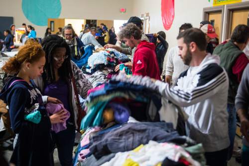 Chris Detrick  |  The Salt Lake Tribune
Donated clothes are sorted and given away during Salt Lake City Mission's 22nd annual Thanksgiving Day Dinner For The Homeless at the Christian Life Center Thursday November 26, 2015.