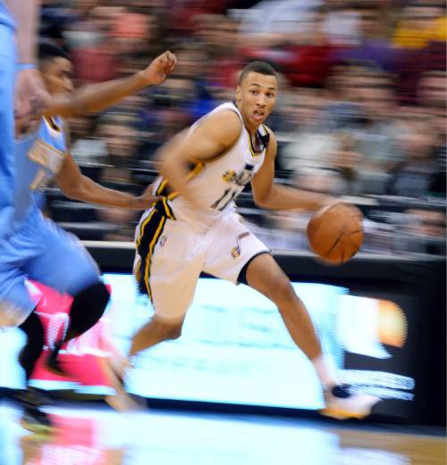 Steve Griffin  |  The Salt Lake Tribune

Utah Jazz guard Dante Exum (11) drives to the basket during second half action in the Jazz versus Nuggets NBA game at EnergySolutions Arena in Salt Lake City, Wednesday, April 1, 2015.