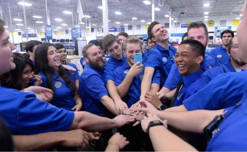 Al Hartmann  |  The Salt Lake Tribune
Best Buy employees at Salt Lake City's 2100 S. 300 W. store enjoy a laugh and huddle just before 5 p.m. Thursday Nov. 26 before opening the doors to hundreds of shoppers lined up outside eager for special deals.