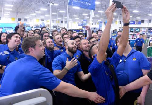 Al Hartmann  |  The Salt Lake Tribune
Best Buy employees at Salt Lake City's 2100 S. 300 W. store take a group selfie during a pep talk just before 5 p.m. Thursday Nov. 26 before opening the doors to hundreds of shoppers lined up outside eager for special deals.