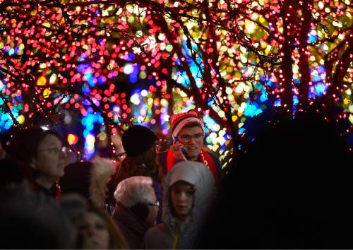 Scott Sommerdorf   |  The Salt Lake Tribune
People take in the holiday lights on Temple Square, Friday, November 27, 2015.