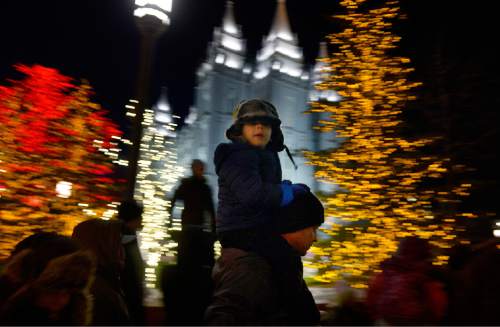 Scott Sommerdorf   |  The Salt Lake Tribune
A young boy takes in the sights from atop his father's shoulders as he looks at the holiday lighting display on Temple Square, Friday, November 27, 2015.