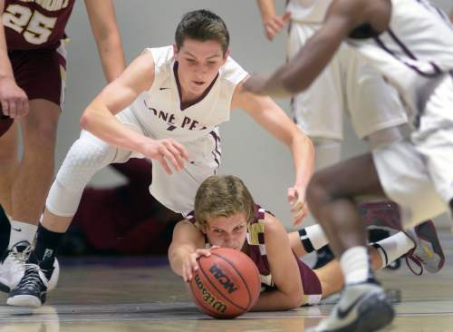 Steve Griffin  |  The Salt Lake Tribune

Viewmont's Jacob Walker (10) stretches for the ball as Lone Peak's Tyson Doman (1) dives over him during quarterfinals of the boy's 5A basketball state tournament game at the Dee Event Center in Ogden, Wednesday, February 25, 2015.
