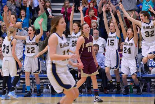 Leah Hogsten  |  The Salt Lake Tribune
Skyline's starters explode off the bench to congratulate teammate Madison Grange #25 who sunk a three-pointer in the final seconds of the game.  Skyline High School girls basketball team  defeated Maple Mountain High School 56-39 during the 4A State Championships semi-final game, Friday, February 20, 2015 at Salt Lake Community College's Lifetime Activities Center.