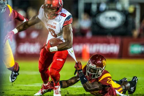 Chris Detrick  |  The Salt Lake Tribune
Utah Utes wide receiver Bubba Poole (8) is tackled by USC Trojans safety Leon McQuay III (22) during the game at the Los Angeles Memorial Coliseum Saturday October 24, 2015.