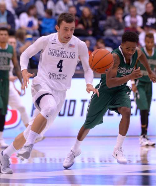 Leah Hogsten  |  The Salt Lake Tribune
Brigham Young Cougars guard Nick Emery (4) steals from Adams State Grizzlies guard Joe Bell Austin (2). Brigham Young University leads Adams State Grizzlies, 42-29 at the halfNovember 20, 2015 at Marriott Center, Provo.