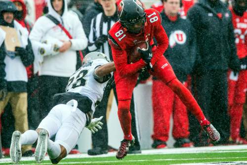 Chris Detrick  |  The Salt Lake Tribune
Utah Utes wide receiver Tyrone Smith (81) is tackled by Colorado Buffaloes defensive back Ahkello Witherspoon (23) during the game at Rice-Eccles Stadium Saturday November 28, 2015.  Utah is winning the game 10-7 at halftime.