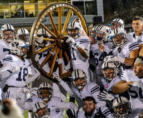 Trent Nelson  |  The Salt Lake Tribune
BYU players pose after the win as Utah State hosts BYU, NCAA football in Logan, Saturday November 28, 2015.