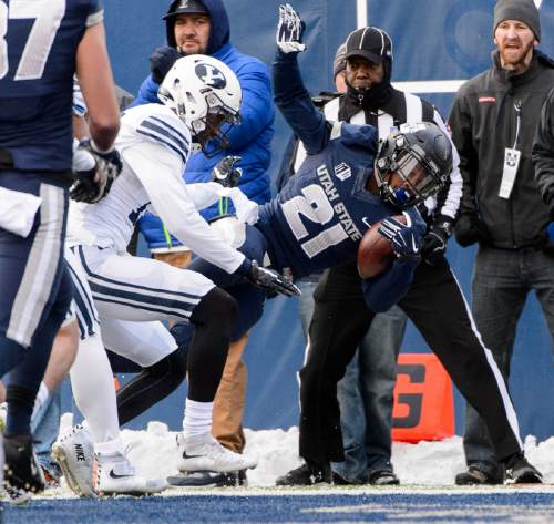 Trent Nelson  |  The Salt Lake Tribune
Utah State Aggies running back LaJuan Hunt (21) dives into the end zone for a touchdown as Utah State hosts BYU, NCAA football in Logan, Saturday November 28, 2015.