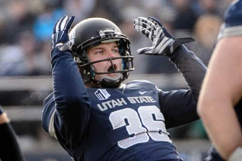 Trent Nelson  |  The Salt Lake Tribune
Utah State Aggies place kicker Jake Thompson (36) reacts to a field goal attempt hitting the post as Utah State hosts BYU, NCAA football in Logan, Saturday November 28, 2015.