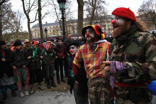 Activists protest ahead of the 2015 Paris Climate Conference at the place de la Republique, in Paris, Sunday, Nov. 29, 2015. More than 140 world leaders are gathering around Paris for high-stakes climate talks that start Monday, and activists are holding marches and protests around the world to urge them to reach a strong agreement to slow global warming. (AP Photo/Thibault Camus)
