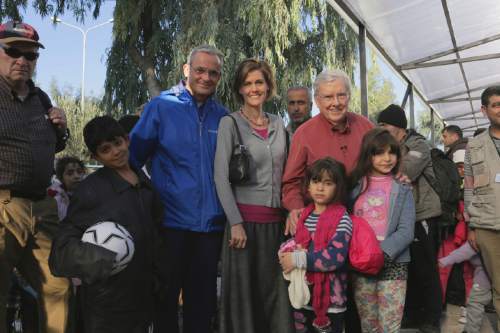 Courtesy  |  LDS Newsroom

Elder M. Russell Ballard (right) and other leaders of The Church of Jesus Christ of Latter-day Saints pause for a photo during a visit with guests of a refugee shelter on the Greek island of Lesbos, Friday, November 20, 2015.