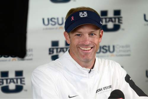 Scott Sommerdorf   |  The Salt Lake Tribune
In a post-game interview, Utah State Aggies head coach Matt Wells laughs as he says the only thing he was upset about was he "didn't know who to give the game balls to" after Utah State defeated Boise State 52-26 in Logan, Friday, October 15, 2015.
