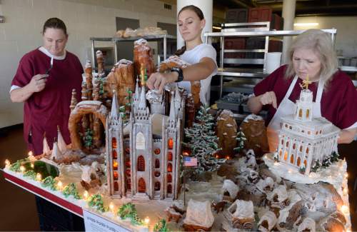Al Hartmann  |  The Salt Lake Tribune
Sally Krivanek, left, Kelsee Bell and Robin Radcliff, culinary students at the Women's Correctional put finishing touches on a massive gingerbread display before being transported to the South Towne Center and donated to the Festival of Trees.  This year's theme is Utah History, featuring the Nauvoo Temple, Mormon wagon train and the Salt Lake Temple.