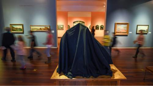 Francisco Kjolseth | The Salt Lake Tribune
The Utah Museum of Fine Arts (UMFA) joins thousands of other arts institutions in observing the 26th annual Day With(out) Art on Tuesday, December 1, 2015. Throughout the day Cyrus Edwin Dallin's The Scout (1910) will be draped in black cloth. This bronze sculpture in the Museum's art of Utah and the West collection depicts a mounted Native American scout peering into the distance--the future. When covered, the figure's view of his surroundings will be obstructed, and visitors' view of this important piece will be denied. The Museum will also offer visitors several opportunities to reflect on the ongoing effects of AIDS on the art world and our society.