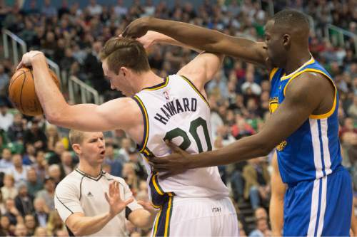 Rick Egan  |  The Salt Lake Tribune

Golden State Warriors forward Draymond Green (23) holds on to Utah Jazz forward Gordon Hayward (20) after he is called for a foul on the play, in NBA action the Utah Jazz vs. the Golden State Warriors, in Salt Lake City, Monday, November 30, 2015.