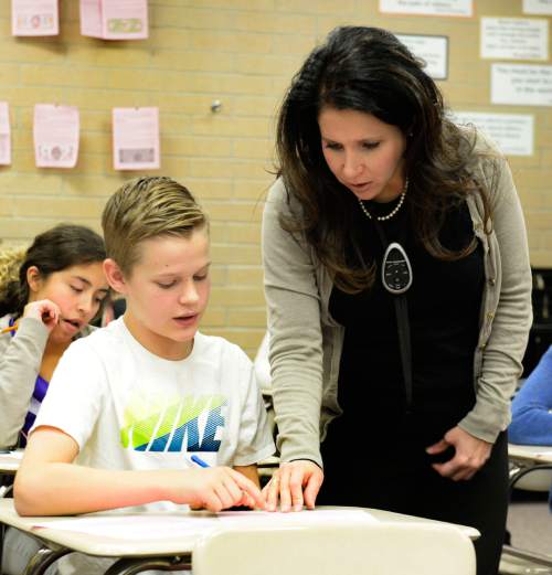 Rick Egan  |  The Salt Lake Tribune

Alex Mason gets some help from Diamond Fork Junior High teacher Kelly Cole, as she teaches history, Friday, November 20, 2015.