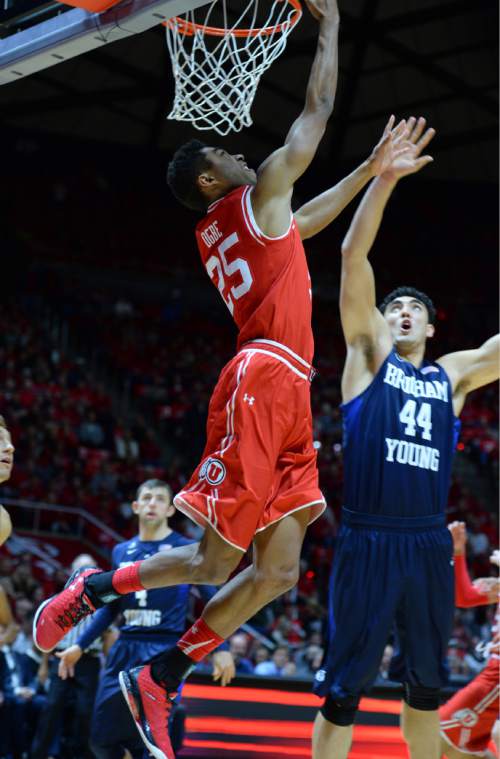Steve Griffin  |  The Salt Lake Tribune

Utah Utes guard Kenneth Ogbe (25) gets past Brigham Young Cougars center Corbin Kaufusi (44)during first half action in the Utah versus BYU men's basketball game at the Huntsman Center in Salt Lake City, Wednesday, December 2, 2015.
