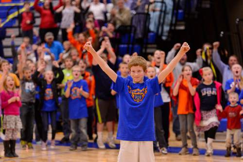 Trent Nelson  |  The Salt Lake Tribune
Britton Thomas celebrates the twenty dollars he won by sinking a three-point shot during halftime of the first high school basketball game in the Water Canyon School gym, which used to be the FLDS bishop's storehouse, in Hildale, Wednesday December 2, 2015.