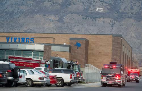 Rick Egan  |  The Salt Lake Tribune

Emergency crews and swat teams outside Pleasant Grove High school, where a student reported seeing someone with a weapon, Thursday, December 3, 2015.