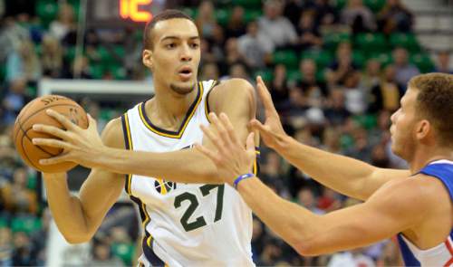 Rick Egan  |  The Salt Lake Tribune

Los Angeles Clippers forward Blake Griffin (32) defends as Utah Jazz center Rudy Gobert (27) controls the ball, in pre-season NBA action, Utah Jazz vs. The LA Clippers at EnergySolutions Arena, Monday, October 13, 2014