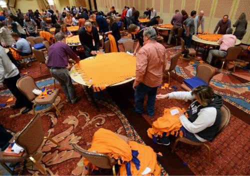 Steve Griffin  |  The Salt Lake Tribune

250 Academy Mortgage managers from across the United States, in conjunction with the company's annual Leadership Summit, work together to make more than 1,000 fleece blankets from 2,500 pounds of fabric for patients at Primary Children's Hospital. They also wrapped over 600 Christmas presents for 25 refugee families who are now living in Salt Lake City. The gifts were all donated by Academy employees and include couches, washing machines and dryers, televisions, DVD players and bikes. The group made the blankets in a ballroom at the Grand America in Salt Lake City, Wednesday, December 2, 2015.