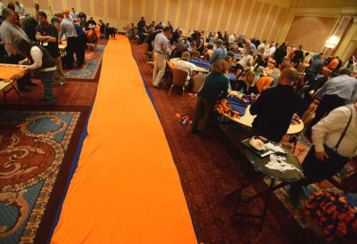 Steve Griffin  |  The Salt Lake Tribune

250 Academy Mortgage managers from across the United States, in conjunction with the company's annual Leadership Summit, work together to make more than 1,000 fleece blankets from 2,500 pounds of fabric for patients at Primary Children's Hospital. They also wrapped over 600 Christmas presents for 25 refugee families who are now living in Salt Lake City. The gifts were all donated by Academy employees and include couches, washing machines and dryers, televisions, DVD players and bikes. The group made the blankets in a ballroom at the Grand America in Salt Lake City, Wednesday, December 2, 2015.