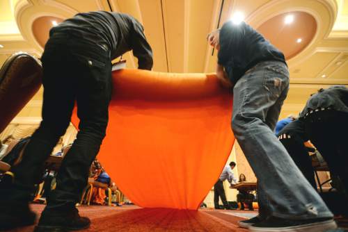 Steve Griffin  |  The Salt Lake Tribune

250 Academy Mortgage managers from across the United States, in conjunction with the company's annual Leadership Summit, work together to make more than 1,000 fleece blankets from 2,500 pounds of fabric for patients at Primary Children's Hospital. They also wrapped over 600 Christmas presents for 25 refugee families who are now living in Salt Lake City. The gifts were all donated by Academy employees and include couches, washing machines and dryers, televisions, DVD players and bikes. The group made the blankets in a ballroom at the Grand America in Salt Lake City, Wednesday, December 2, 2015.