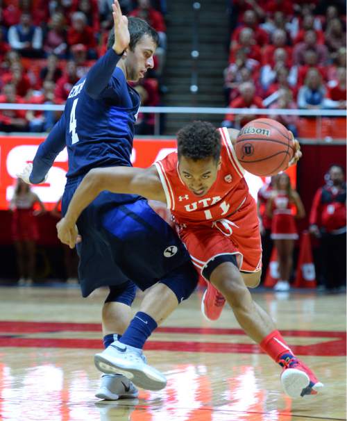 Steve Griffin  |  The Salt Lake Tribune

Utah Utes guard Brandon Taylor (11) drives past Brigham Young Cougars guard Nick Emery (4) during first half action in the Utah versus BYU men's basketball game at the Huntsman Center in Salt Lake City, Wednesday, December 2, 2015.