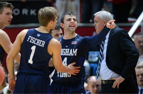 Steve Griffin  |  The Salt Lake Tribune

Brigham Young Cougars guard Nick Emery (4) screams at the Utah bench to sit down after he was called for flagrant foul 2 on Utah Utes guard Brandon Taylor (11) during second half action in the Utah versus BYU men's basketball game at the Huntsman Center in Salt Lake City, Wednesday, December 2, 2015.  Emery was ejected from the game.