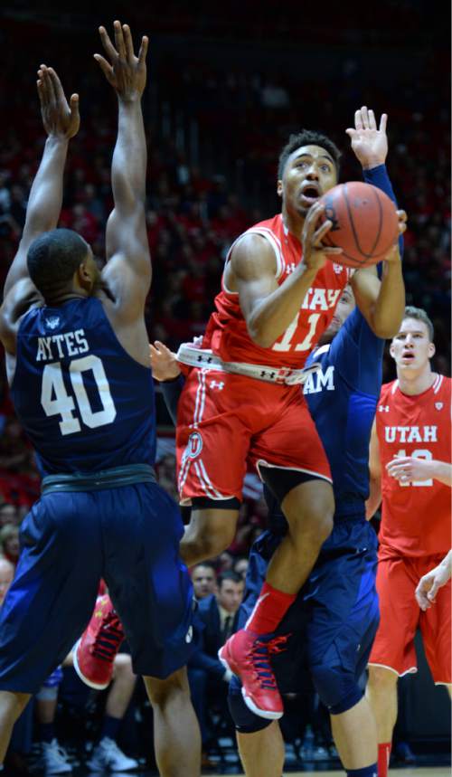 Steve Griffin  |  The Salt Lake Tribune

Utah Utes guard Isaiah Wright (1) splits the BYU defense as he shoots during first half action in the Utah versus BYU men's basketball game at the Huntsman Center in Salt Lake City, Wednesday, December 2, 2015.