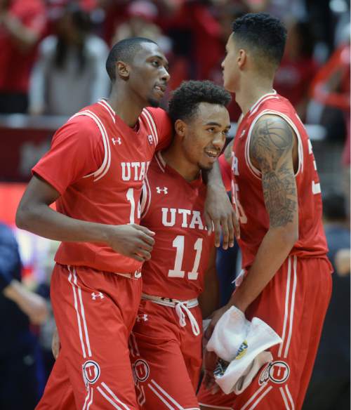 Steve Griffin  |  The Salt Lake Tribune

Utah Utes guard Brandon Taylor (11) smiles as he gets hugged by  Utah Utes forward Dakarai Tucker (14) after he was fouled late in the second half action in the Utah versus BYU men's basketball game at the Huntsman Center in Salt Lake City, Wednesday, December 2, 2015.