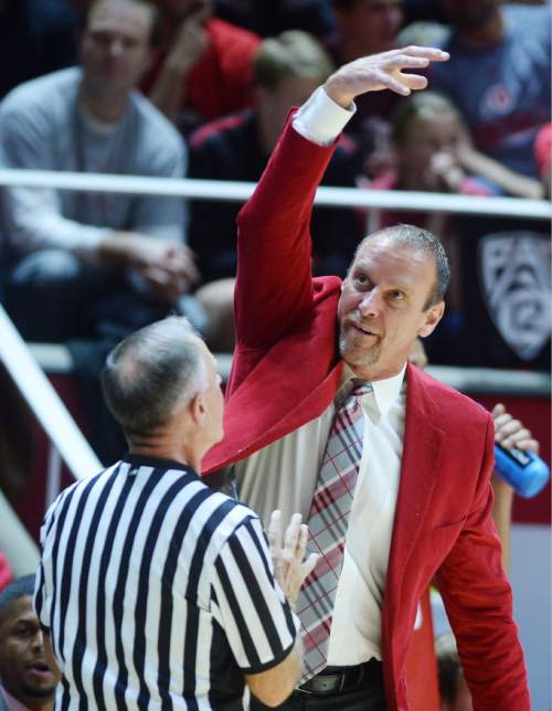 Steve Griffin  |  The Salt Lake Tribune

Utah head coach Larry Kyrstkowiak shows the referee how he thinks Brigham Young Cougars guard Nick Emery (4) was carrying the ball during first half action in the Utah versus BYU men's basketball game at the Huntsman Center in Salt Lake City, Wednesday, December 2, 2015.