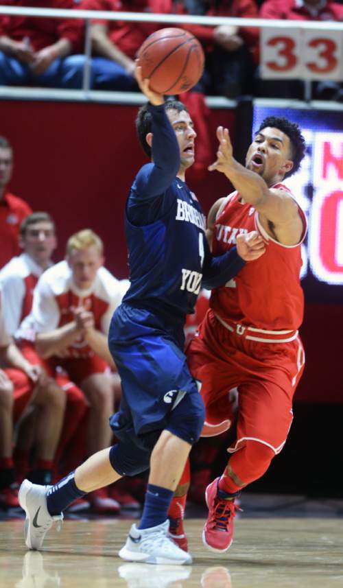 Steve Griffin  |  The Salt Lake Tribune

Brigham Young Cougars guard Nick Emery (4) passes away from Utah Utes guard Isaiah Wright (1) during first half action in the Utah versus BYU men's basketball game at the Huntsman Center in Salt Lake City, Wednesday, December 2, 2015.