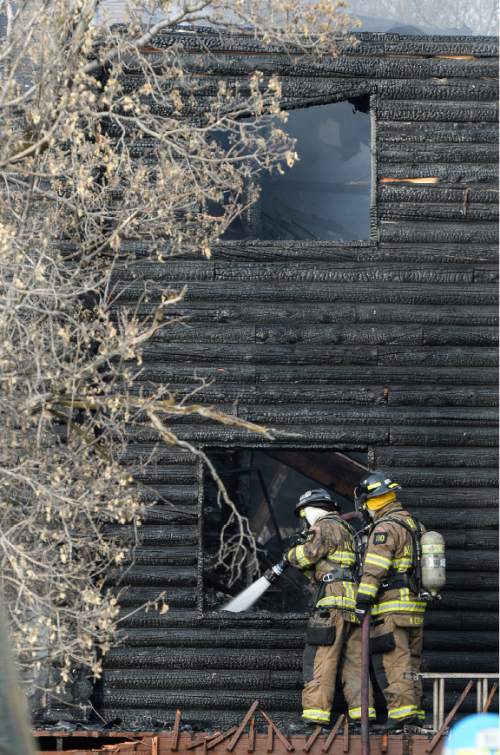 Francisco Kjolseth | The Salt Lake Tribune
Unified Fire Crews clean up a house fire near 1900 E. Creek Road (about 7800 South) in Cottonwood Heights. The cause of the fire is under investigation.