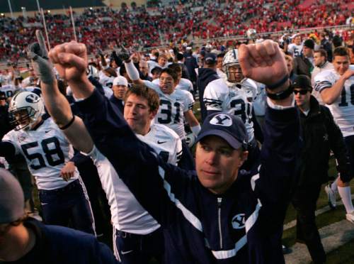 Trent Nelson  |  Tribune File Photo

BYU coach Bronco Mendenhall salutes BYU fans as he leaves the field against Utah at Rice-Eccles Stadium.
 Nov. 25, 2006.